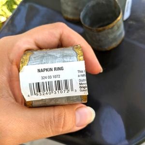 Napkin rings total of 4. New with tags. Silver and bronze color